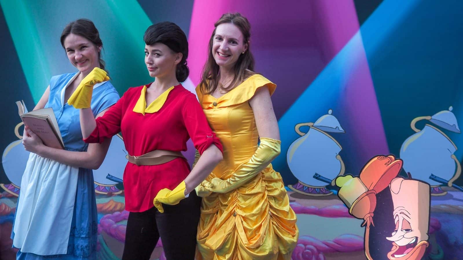 Three actors dressed as disney characters from Beauty and the Beast, booked by our talent booking services.