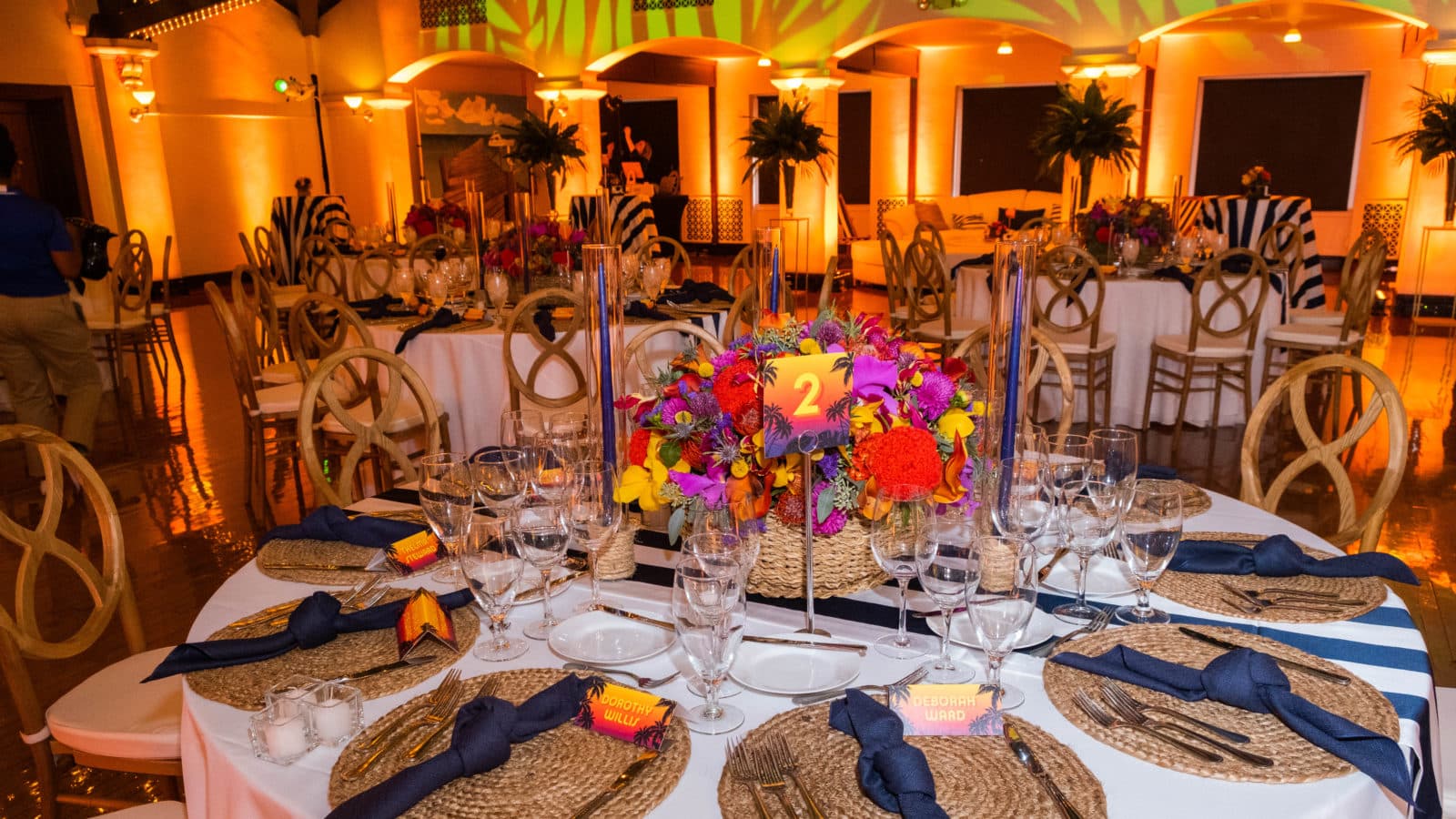 Tropical Centerpieces under a drop-ceiling of palm leaves