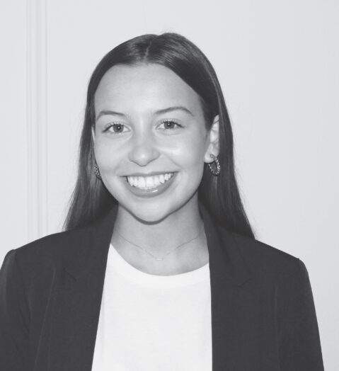 Julia Mahoney, contemporary productions employee, photo of her smiling against a white background